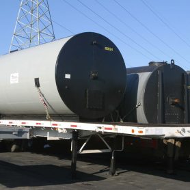 Portable sealcoat storage tanks at jobsite